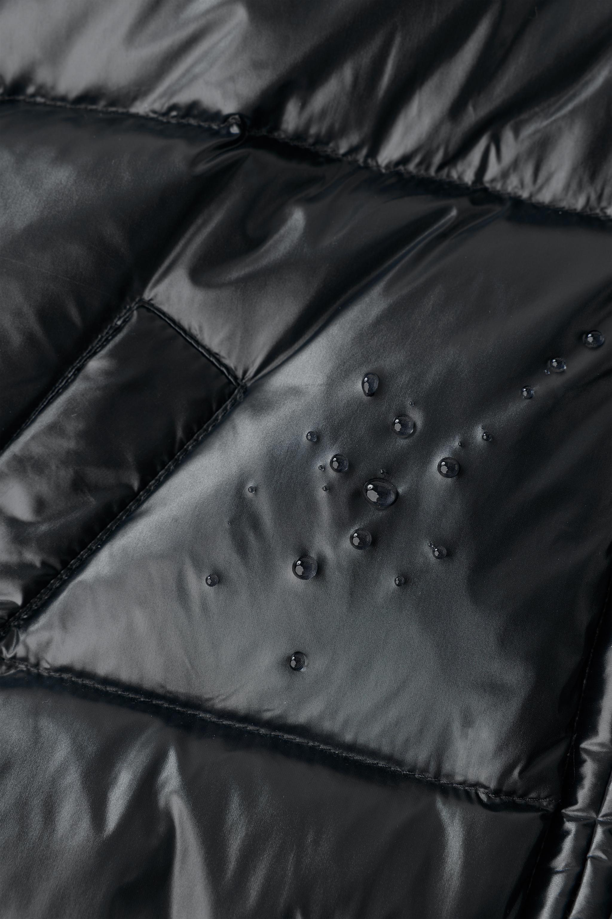 DOUDOUNE EN PLUME ET DUVET À CAPUCHE DÉPERLANTE